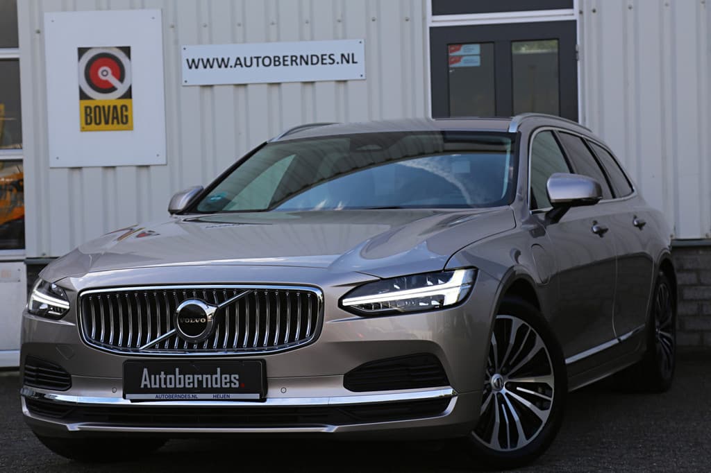 Volvo V90 2.0 T6 Plug-in hybrid 350PK AWD Long Range*Bright Dusk Metallic!*Fabrieksgarantie*Elek. Trekhaak/Pilot ass./ACC/Stoelverw.V+A/Stuurwielverw./Leder/Dodehoek/Camera/Apple Carplay-Android/18 inch LM* — foto 1 van 25